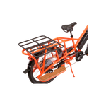 up close image of a black rack platform mounted on the back of an orange wagon bike