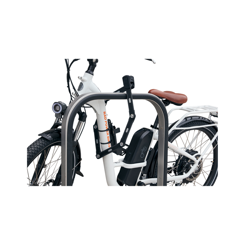 Side view of ABUS Bordo Granit X-Plus 6500 Folding Lock safely locking a bike rack and ebike.