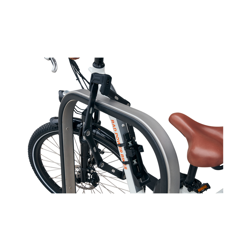 Side view of ABUS Bordo Granit X-Plus 6500 Folding Lock safely locking an ebike's front wheel to a bike rack.