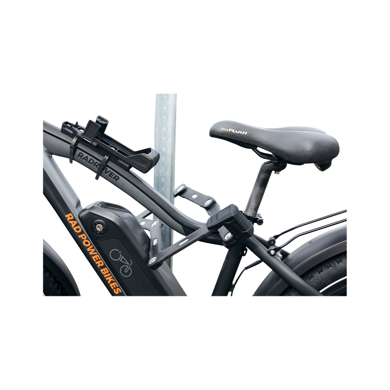 Close up side view of ABUS Bordo Granit X-Plus 6500 Folding Lock safely locking an ebike through the frame to a bike rack.