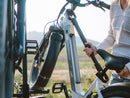 A person uses a Bike Adapter Bar to attach an ebike to an RV rear rack