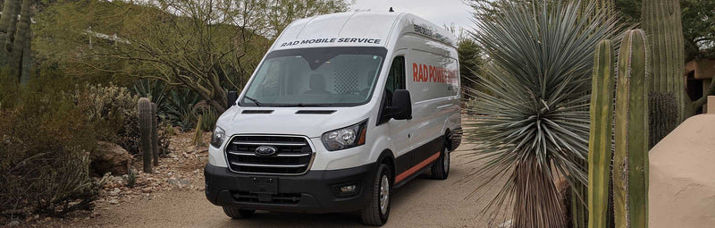 The Rad Mobile van alongside cactuses in Phoenix, Arizona.