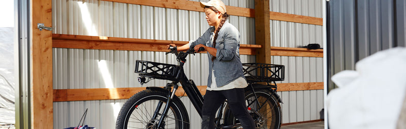 A woman takes her RadRover 6 Plus out of the garage.