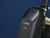 Black ebike battery against a blue background