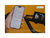 A hand holding a cell phone showing a map close to the display on a green ebike. 