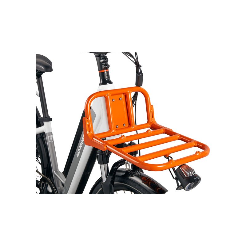 Close up of orange Front Rack attached to a white ebike.
