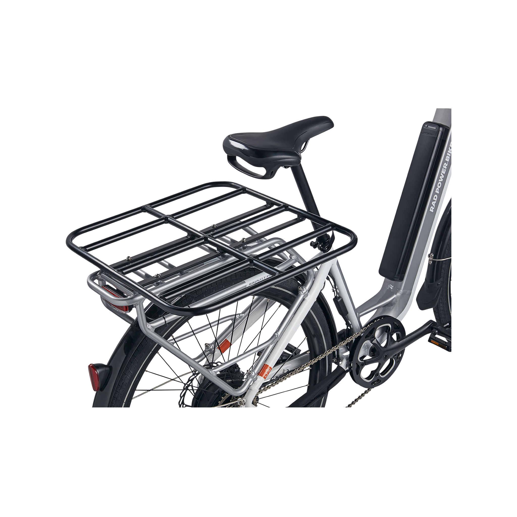 up close view of black rack platform mounted on the back of a silver city bike 