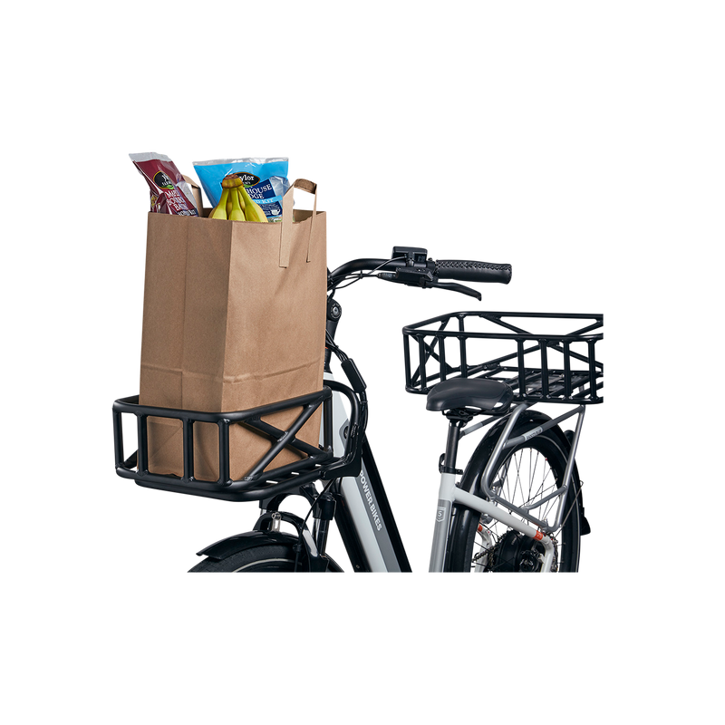 Side front view of the Small Basket holding a full grocery bag while installed on a front rack on a RadCity