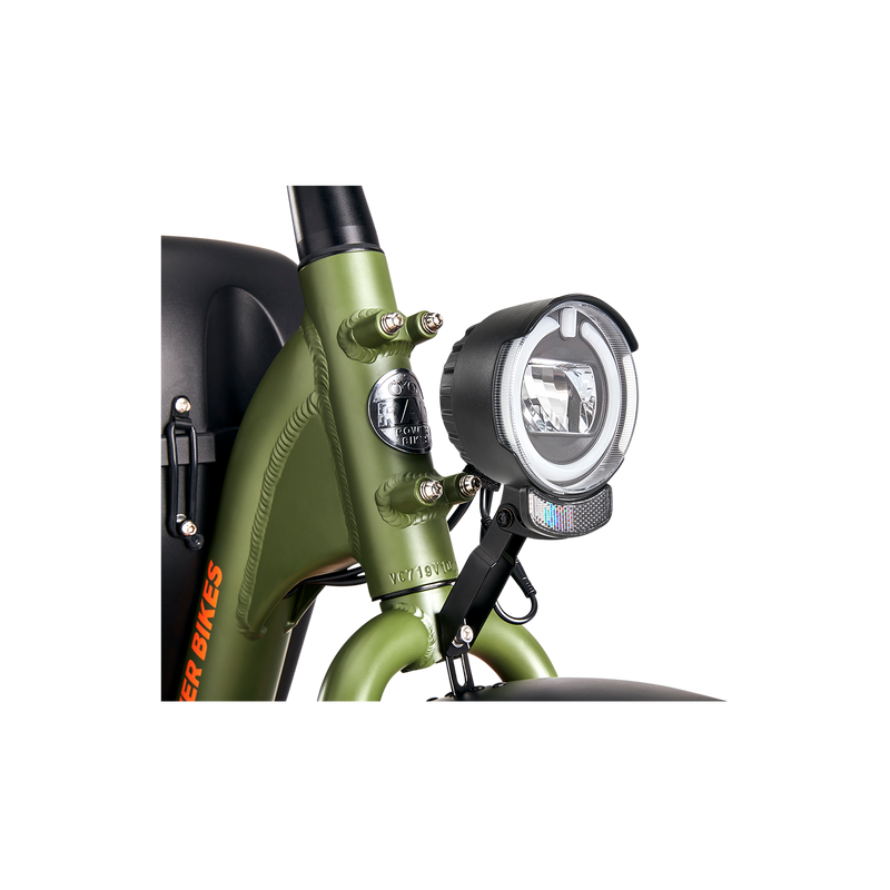 A head light mounted to a green Ebike