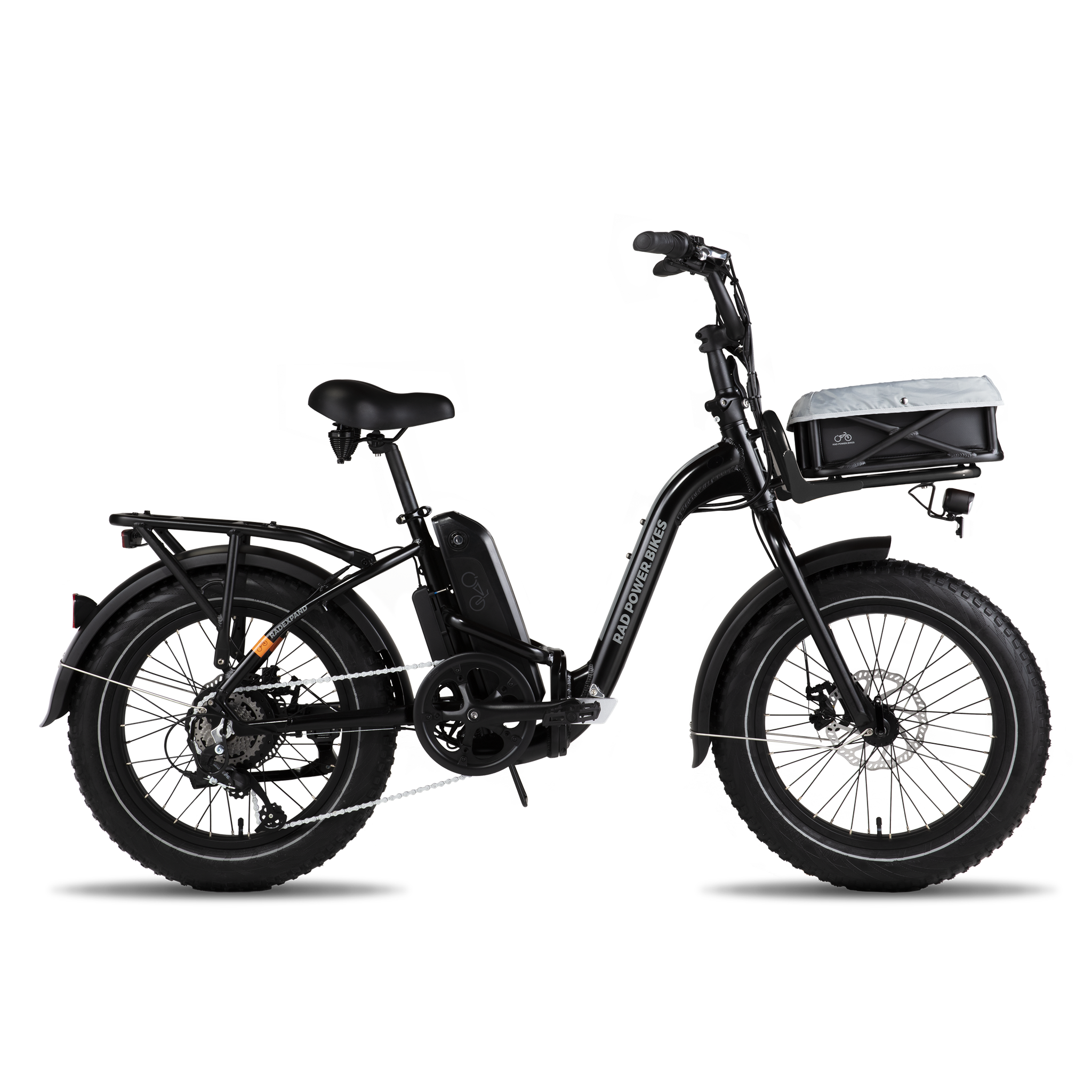 A side view of an ebike with a front basket that contains a pet liner. 