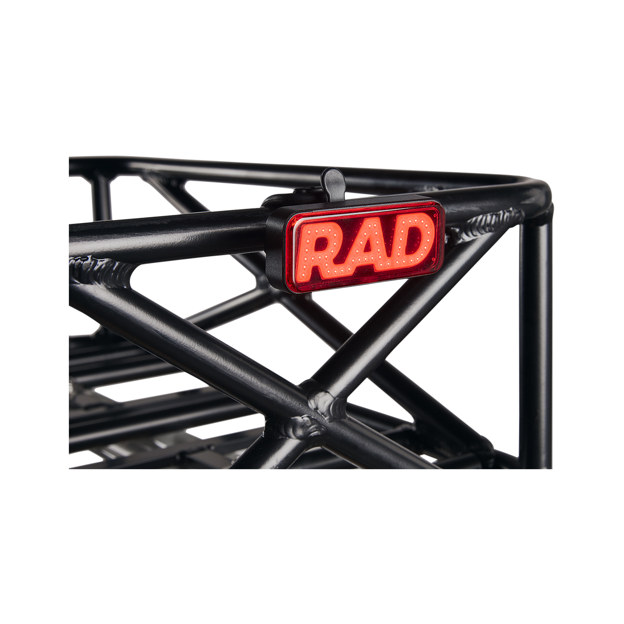Close up picture of Rad Power Bikes Rad logo taillight mounted on a bicycle basket.