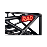 Close up picture of Rad Power Bikes Rad logo taillight mounted on a bicycle basket.