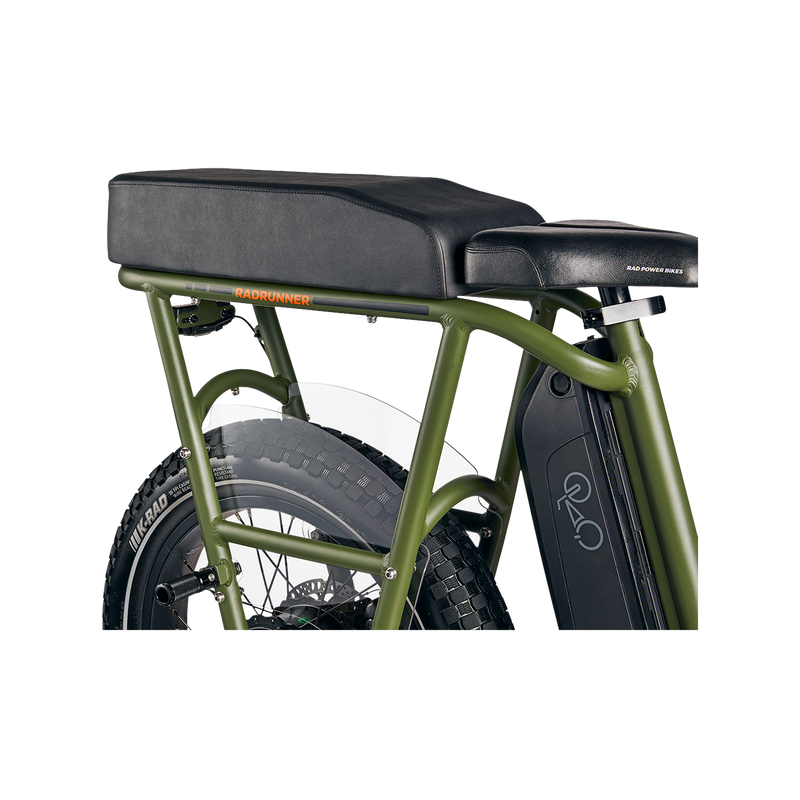 Close up side section of green RadRunner ebike with black passenger seat on rear rack with clear plastic skirt cover and retractable foot pegs.