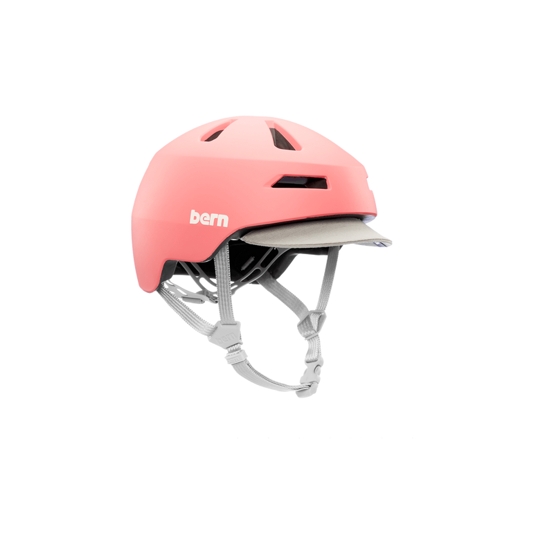 Side view of a pink Bern kids' helmet with a gray visor