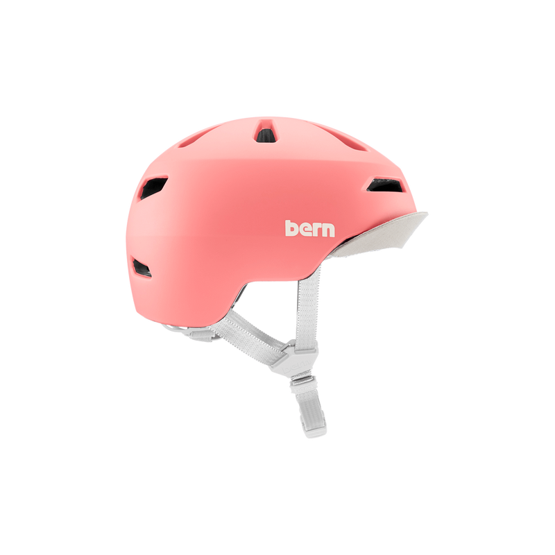 Side view of a pink Bern kids' helmet with a gray visor