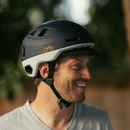 Man wearing a blue Bern x Rad helmet 