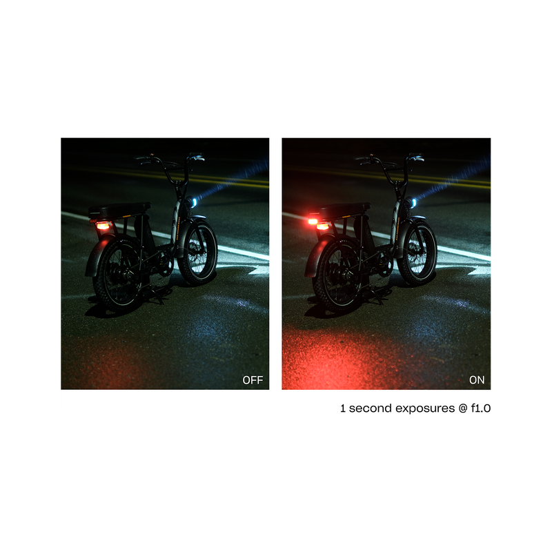 Two side by side photos of a Rad Power Bikes RadRunner electric cargo bike with passenger package parked at night on a damp street, one with Rad logo taillight turned on and one with taillight turned off . Both are mounted below rear seat on the rack.